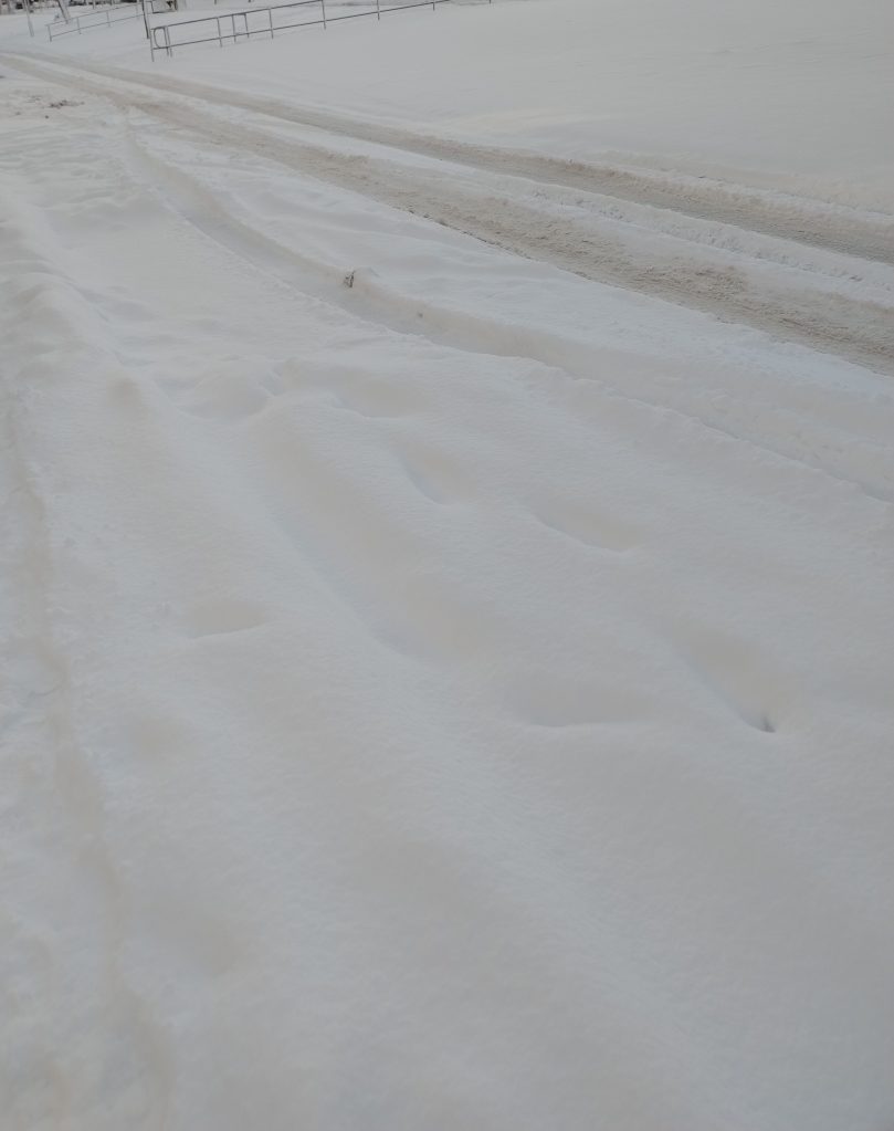 A road covered in snow.